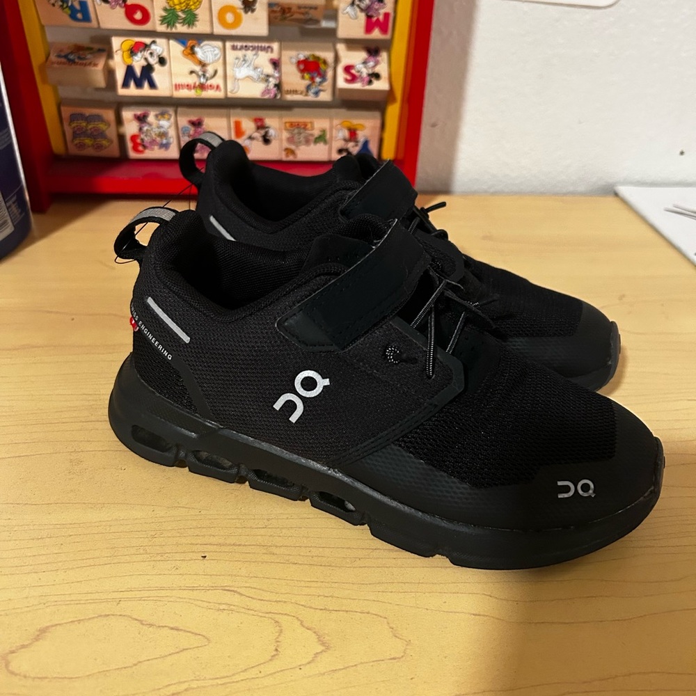 On Running Black Sneakers with CloudTec Technology